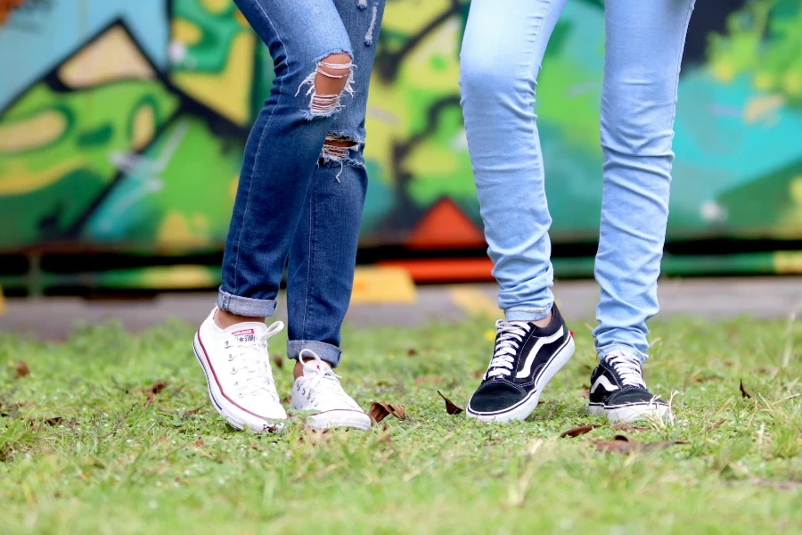 Person's Wearing White and Black Low-top Sneakers