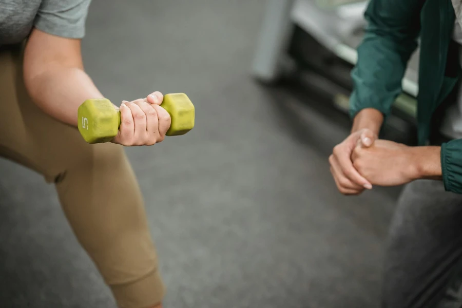 Strong woman lifting dumbbell