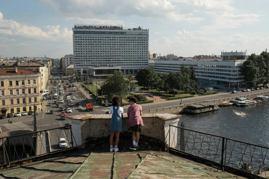 Teenage couple on date standing on rooftop