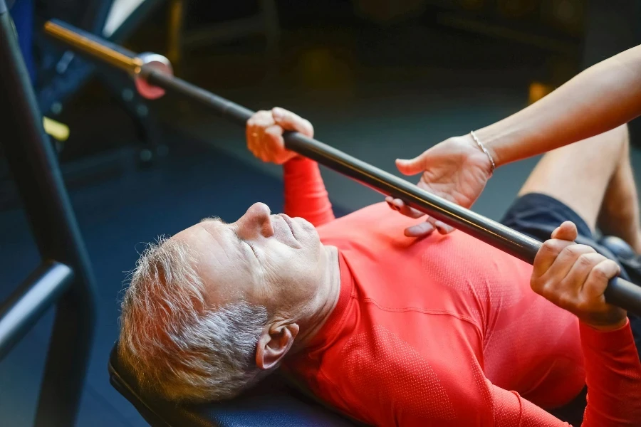 Man Lifting a Bar at the Gym