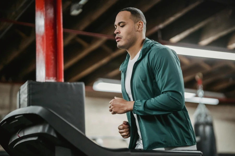 Serious man running on treadmill
