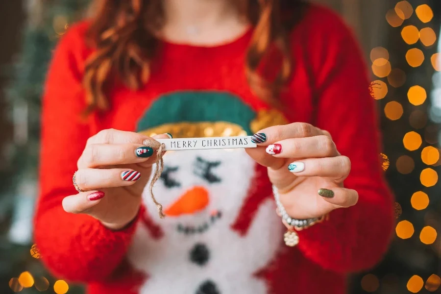 Woman Holding Christmas Decoration in Hands