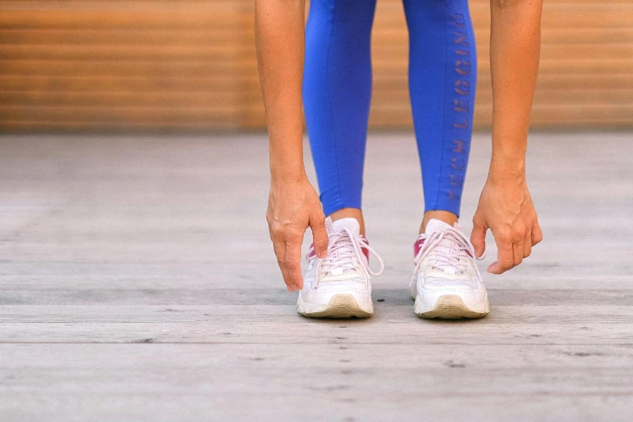 sportswoman in blue leggings