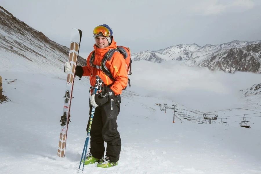 Woman Wearing Orange and Black Snowsuit