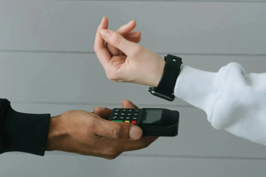 Person in White Long Sleeve Shirt Wearing Smartwatch