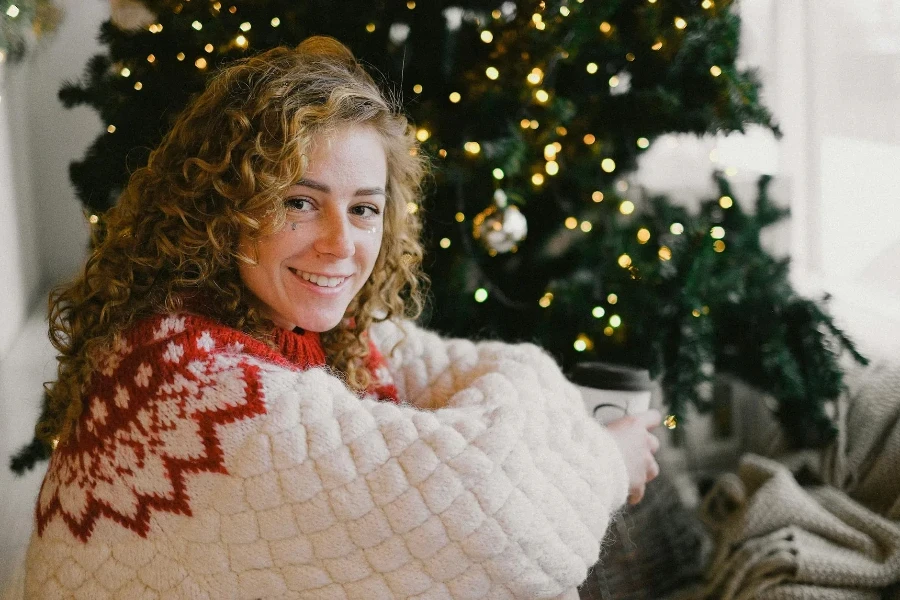 Smiling Blonde Woman in Sweater