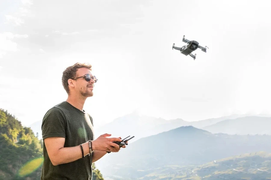 a man is controlling a drone