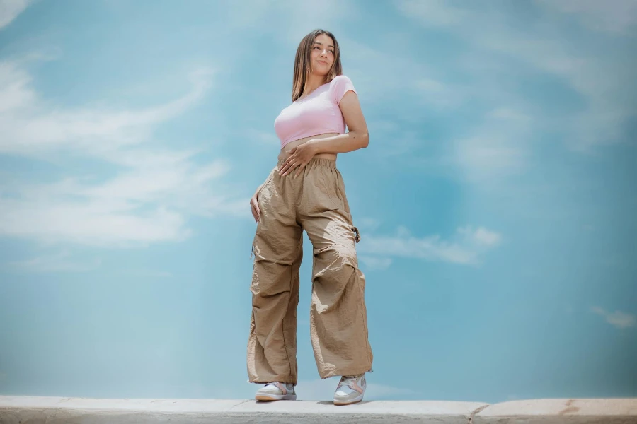 Woman in Beige Loose Pants and Pink T-Shirt