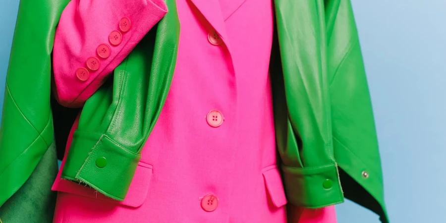 Woman Wearing Pink Blazer and Green Jacket