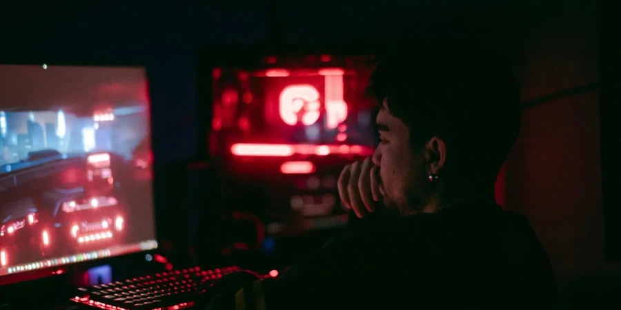 A person sitting in front of a computer screen