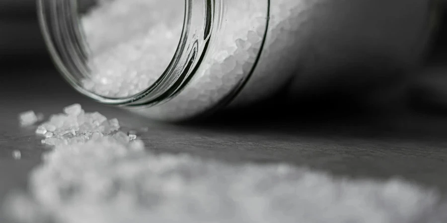 Selective Focus Photo of Salt in Glass Jar