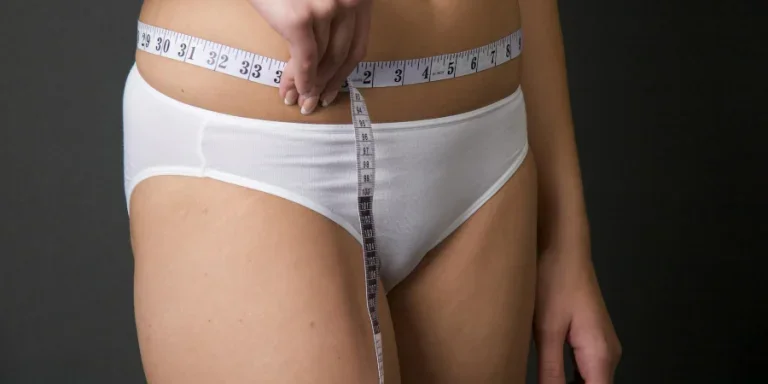 Woman Measuring Her Belly