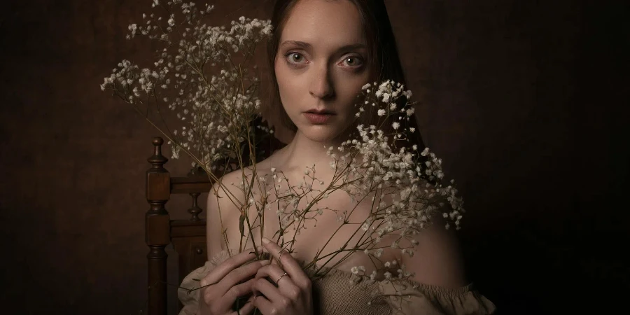 A Woman Holding Baby Breath Flowers