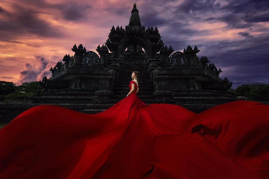 Woman Wearing Red Log Dress Outside Building