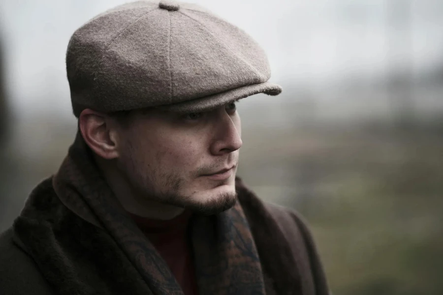 A man in a brown hat and scarf