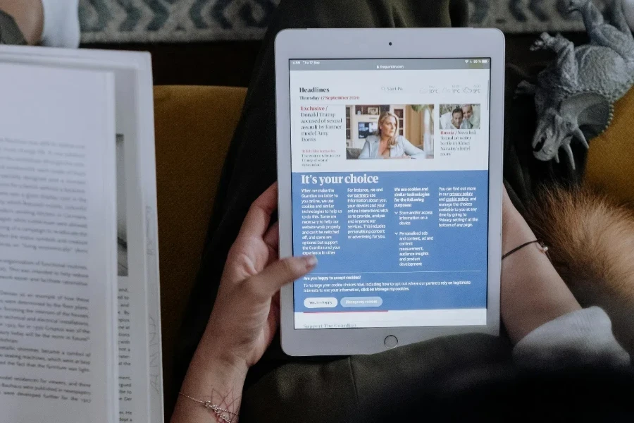 A Person Sitting while Holding a Tablet