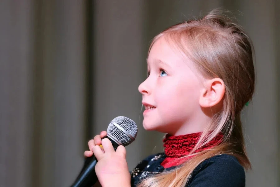 Girl Holding Black Dynamic Microphone