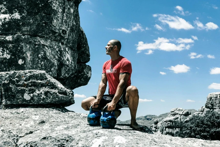 Man Holding Kettlebells