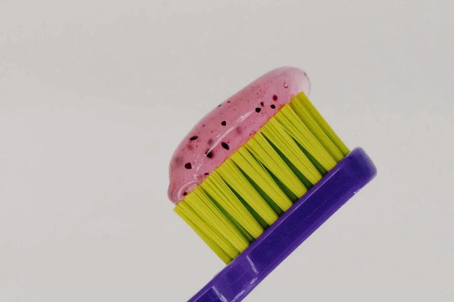 Yellow and Purple Toothbrush with Toothpaste