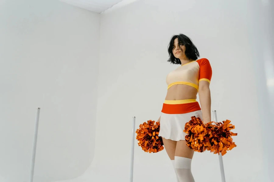 A Cheerleader in Red and White Uniform