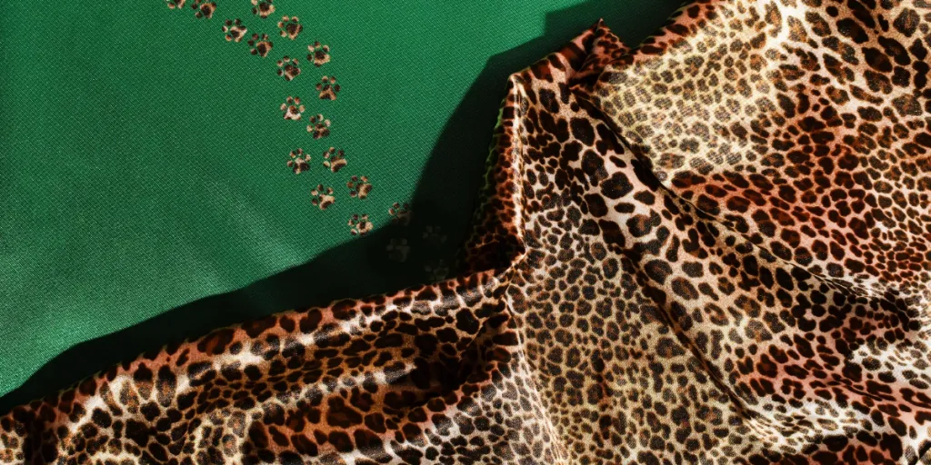 Leopard-print material on green background