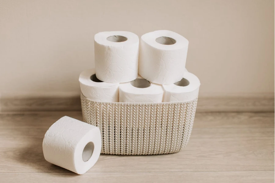 Loose toilet rolls stacked in a wire basket