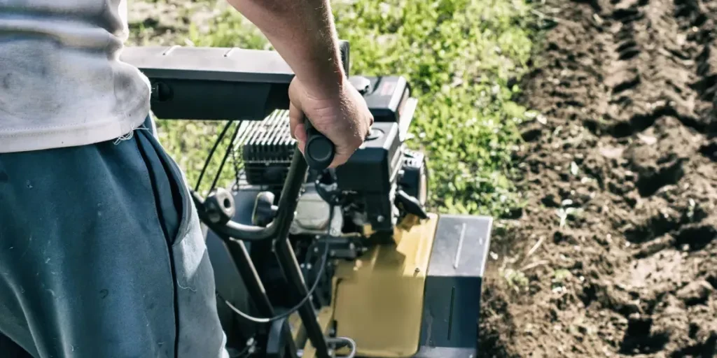 motor cultivator during plow process spring season garden works