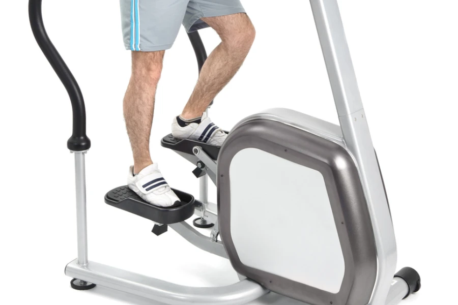 one man doing step machine exercise