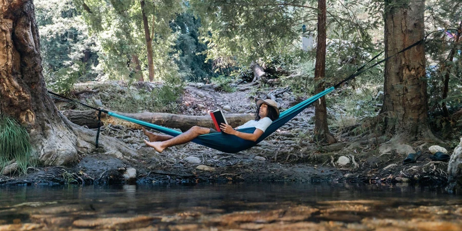 reading book on the hammock