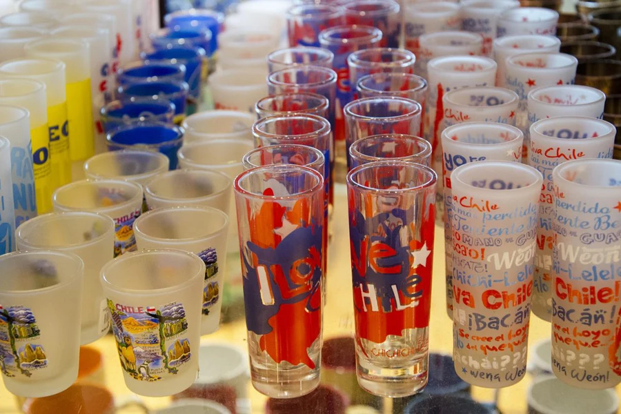 shot glasses come in different sizes, and some are decorated with scenes from touristic attraction in Chile