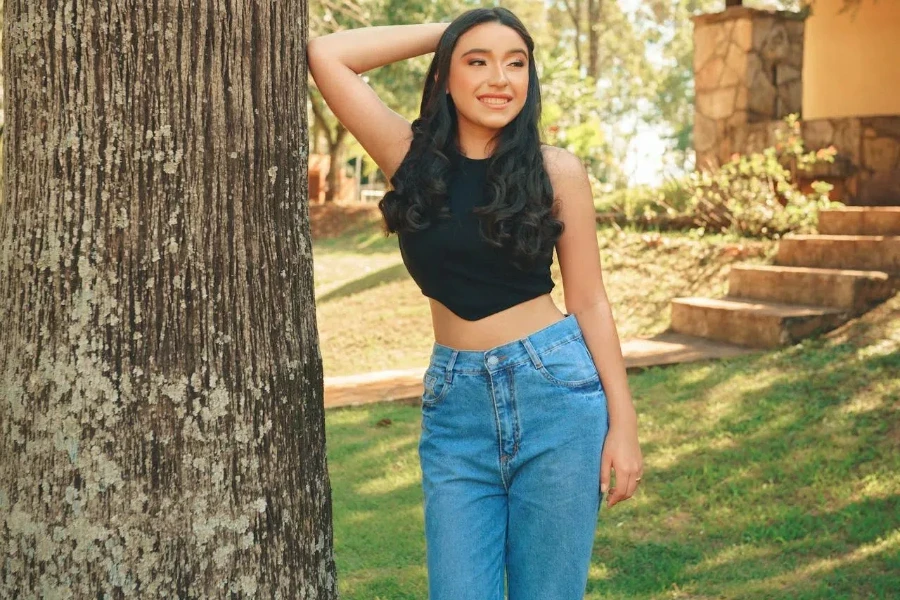 Smiling lady in baggy jeans and work boots