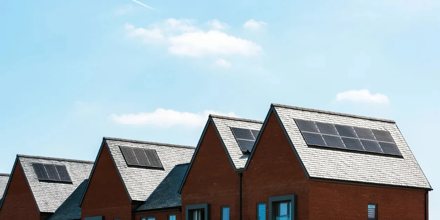 solar panels on roof of new houses in england uk on bright sunny day