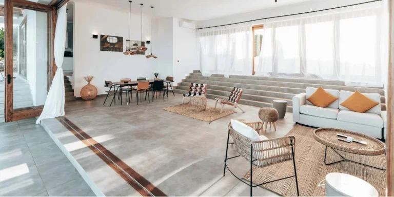 Spacious living room with African decor and rugs