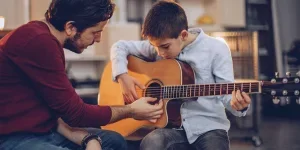 taught to play guitar