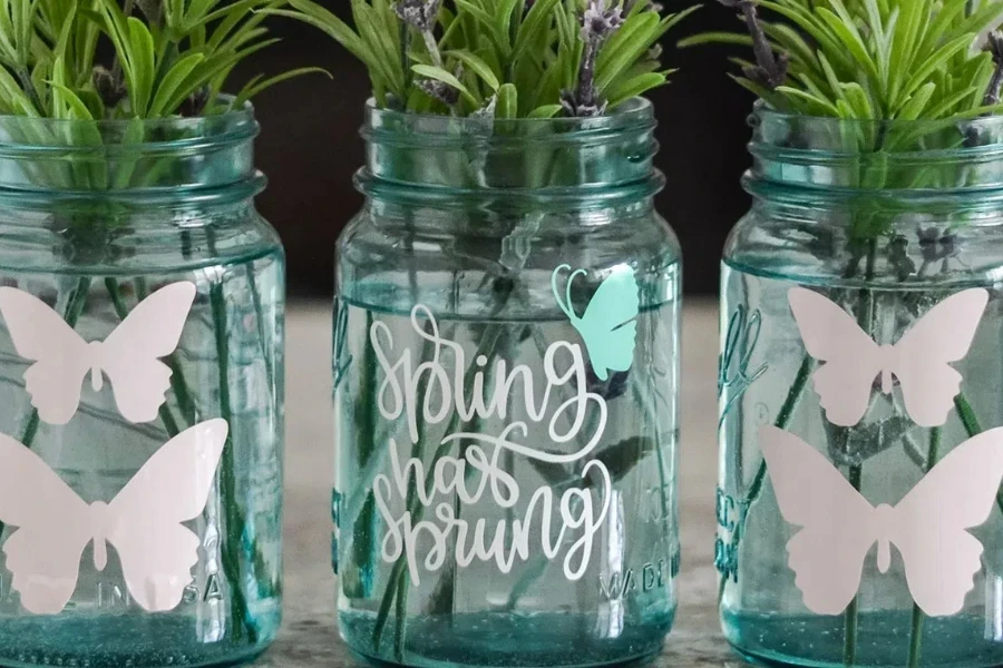 Three glass mason jars with unique designs