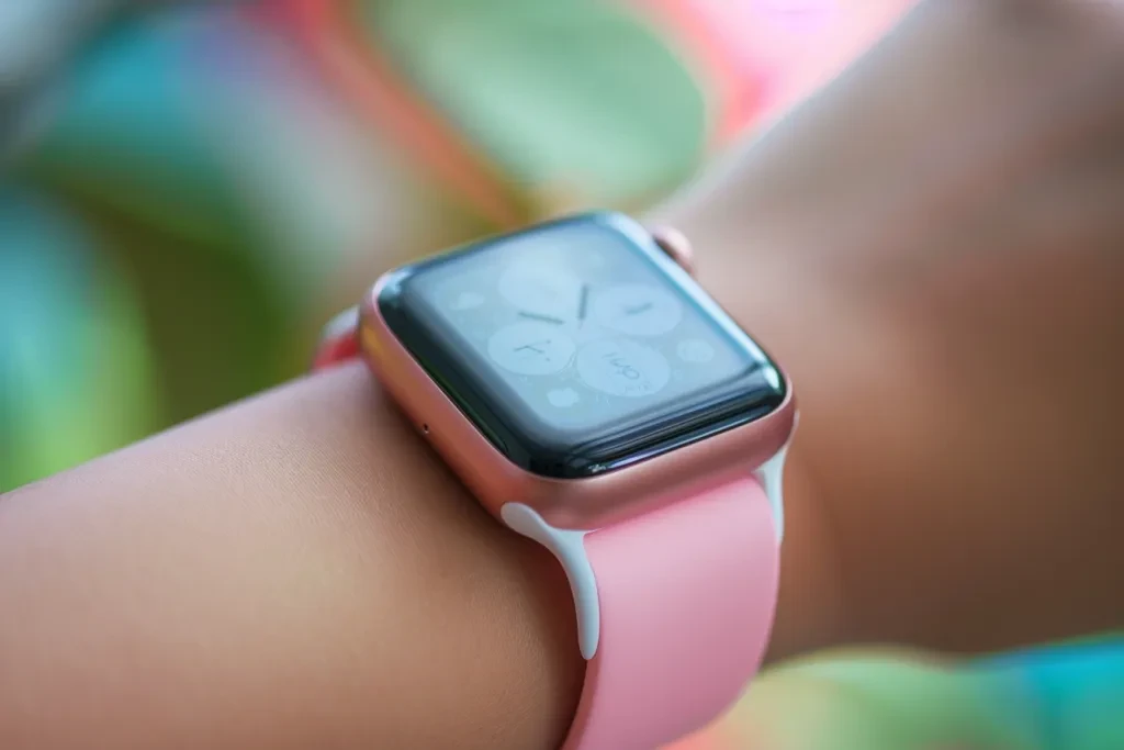 wearing a pink smartwatch