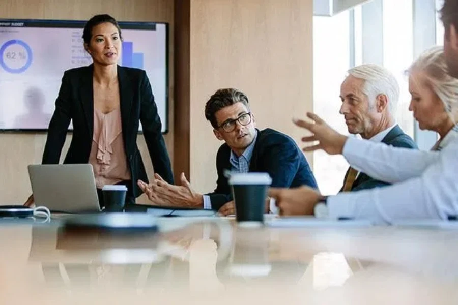 Woman closing her pitch with questions from investors