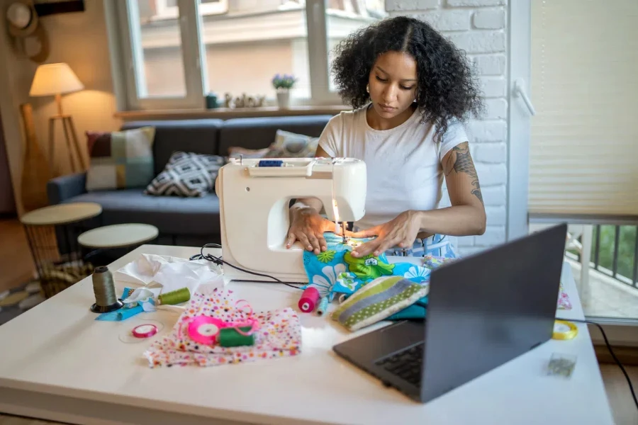 woman is using her sewing machine