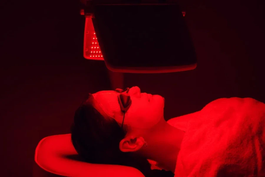 Woman under an LED lamp