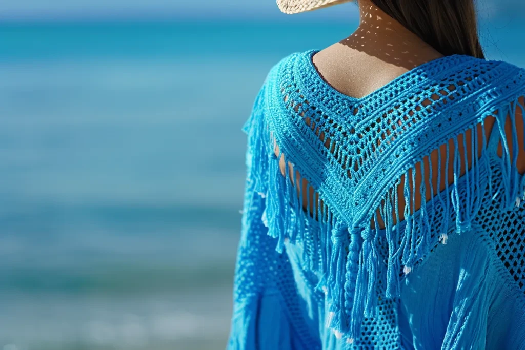 woman's blue beach coverup with crochet tassels