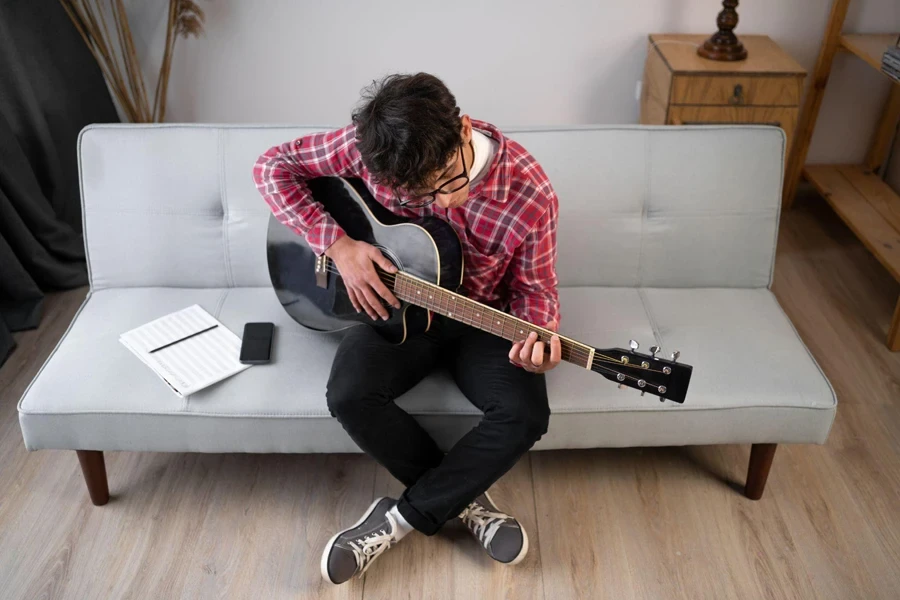 young man playing guitar