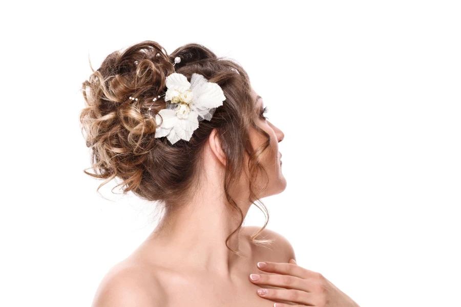 young woman bride with beautiful hairstyle and stylish hair accessory