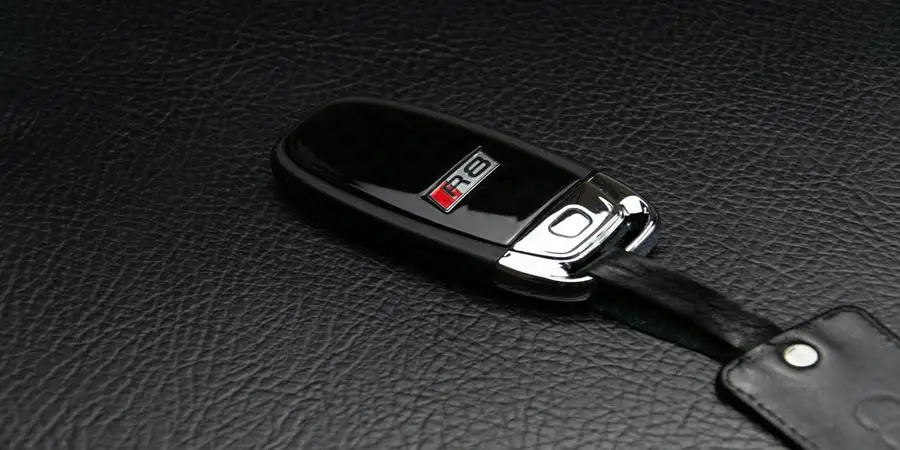 A Car Key on a Leather Surface by Alexander Pöllinger