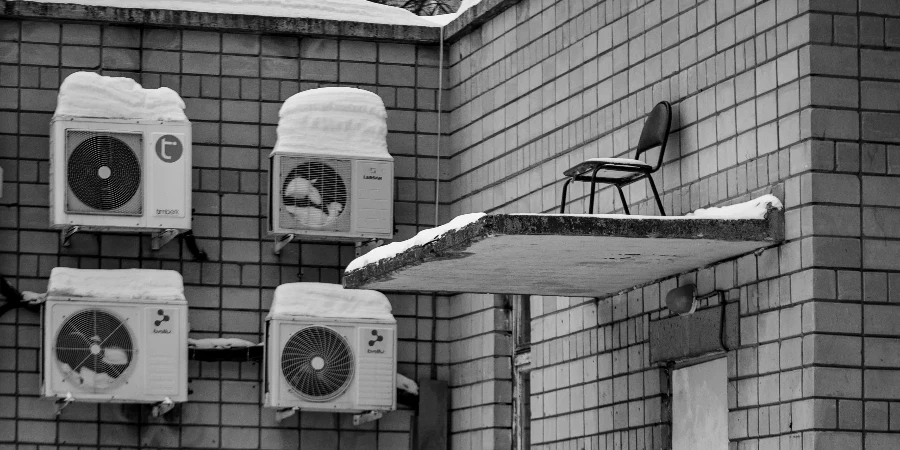 A Grayscale Photo of a Street with Snow Covered Ground