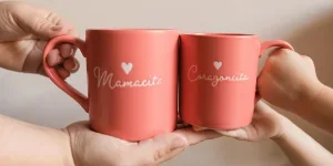 A Mother & Daughter's Hands Holding Matching Pink Mugs That Say Mamacita & Corazoncita on Them with a Heart, Spanish Meaning Cute Mama & Little Love, For Mother's Day