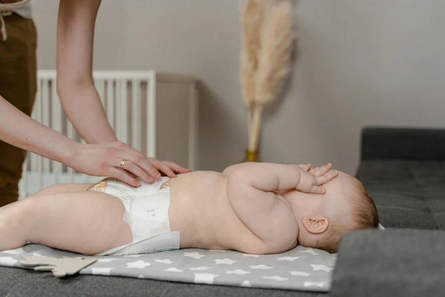 A Parent Changing the Diaper of a Baby