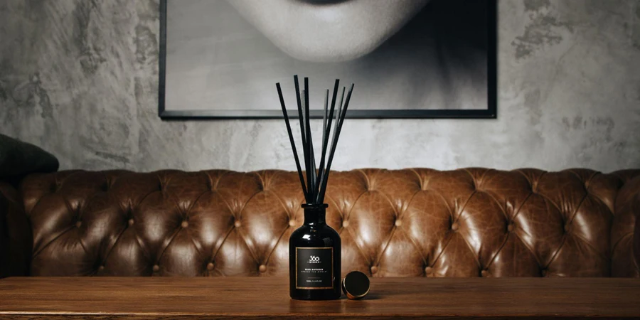 A Reed Diffuser Bottle Placed on a Leather Couch