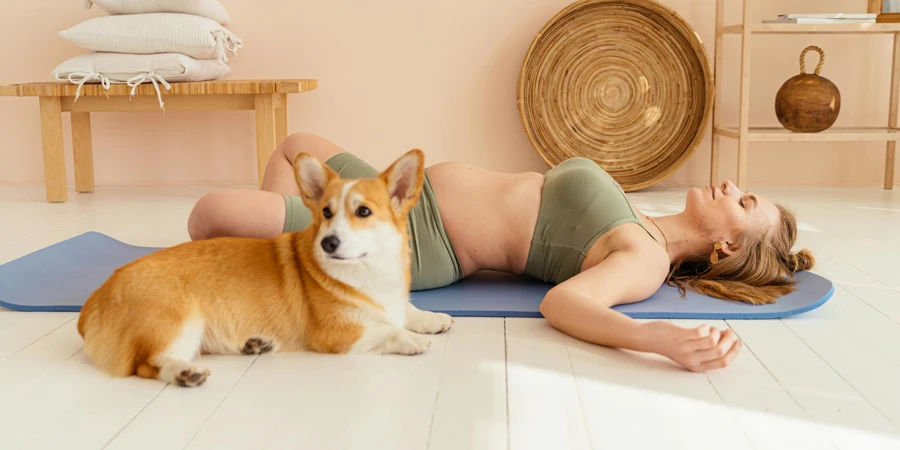 A Woman Lying on the Floor with a Dog