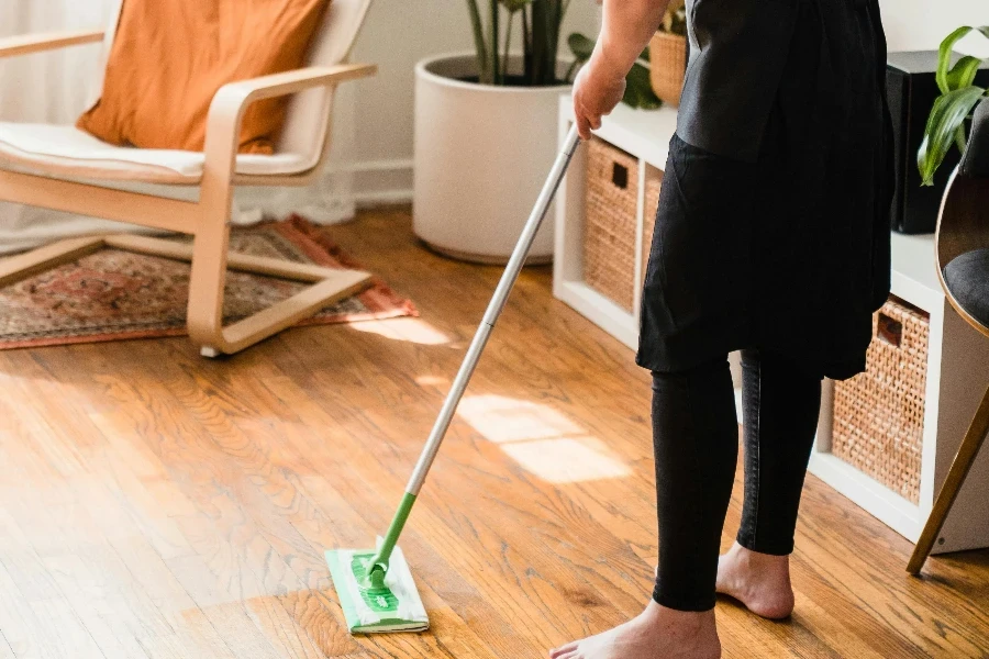 A Woman Sweeping a Floor