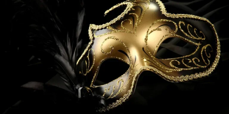 A beautiful carnival mask with black feather and gold decor